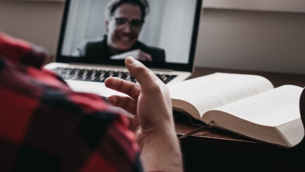 A man with a tablet at home